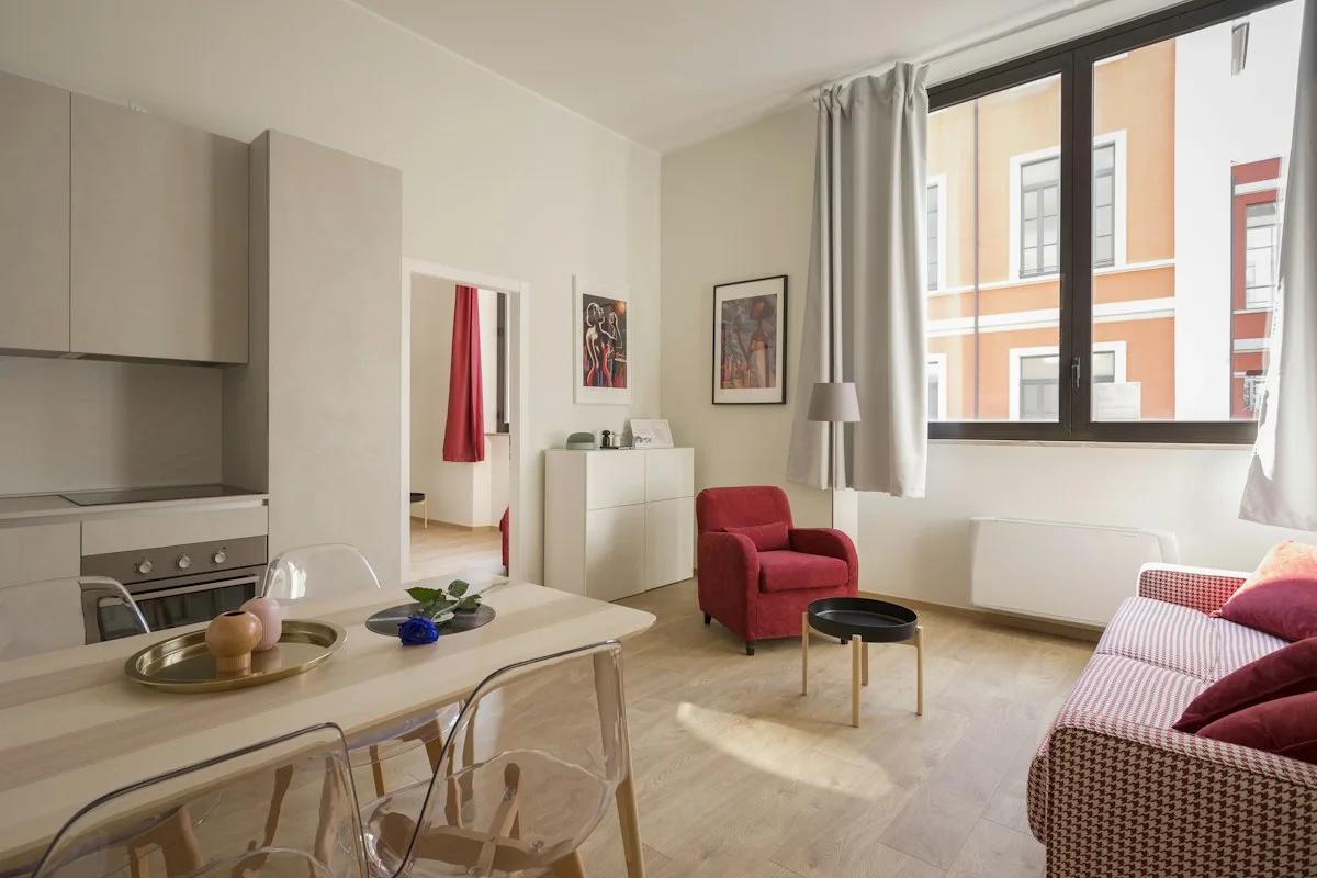 Realistic narrow British flat hallway with estate agent brochure on table